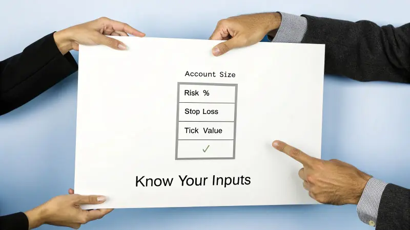 Two hands holding a whiteboard with financial inputs: Account Size, Risk %, Stop Loss, and Tick Value.